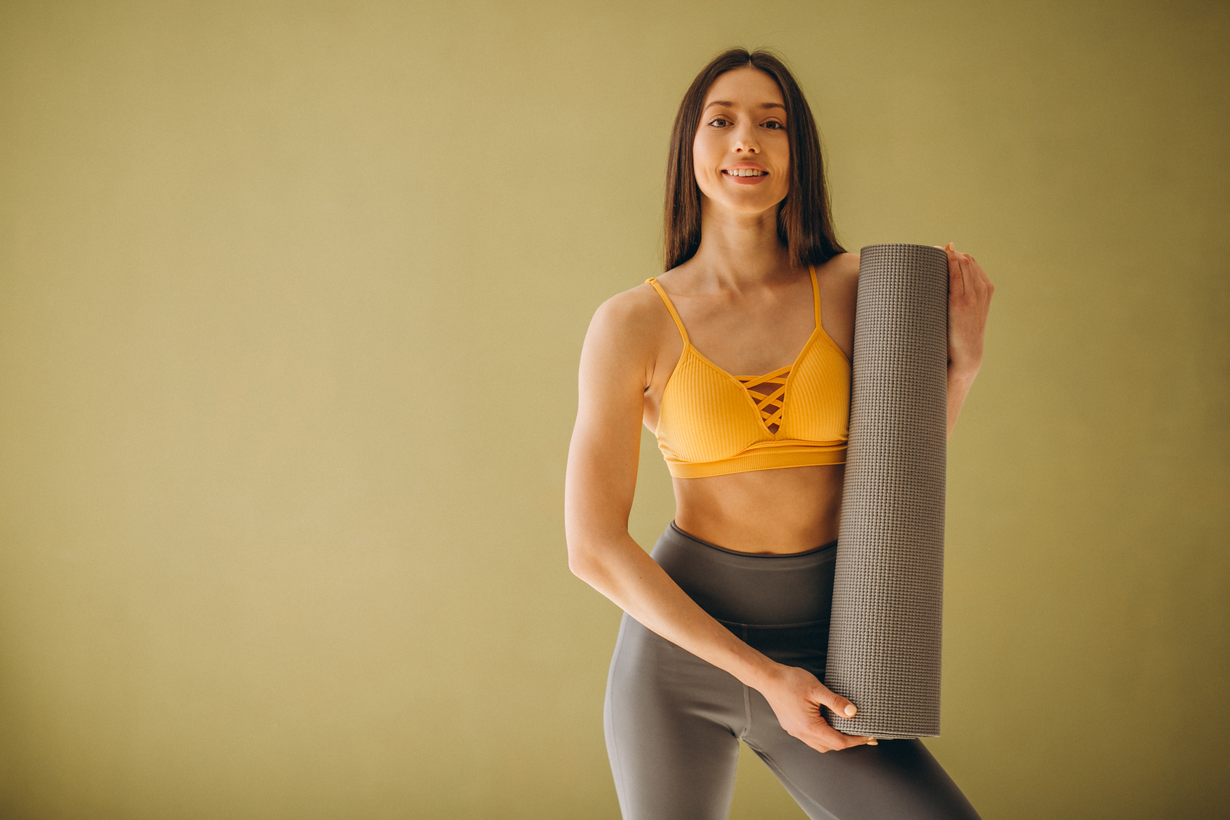 Woman with yoga mat